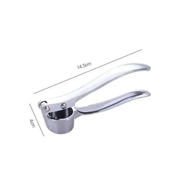 Garlic ginger crusher squeezer in use kitchen cooking tool