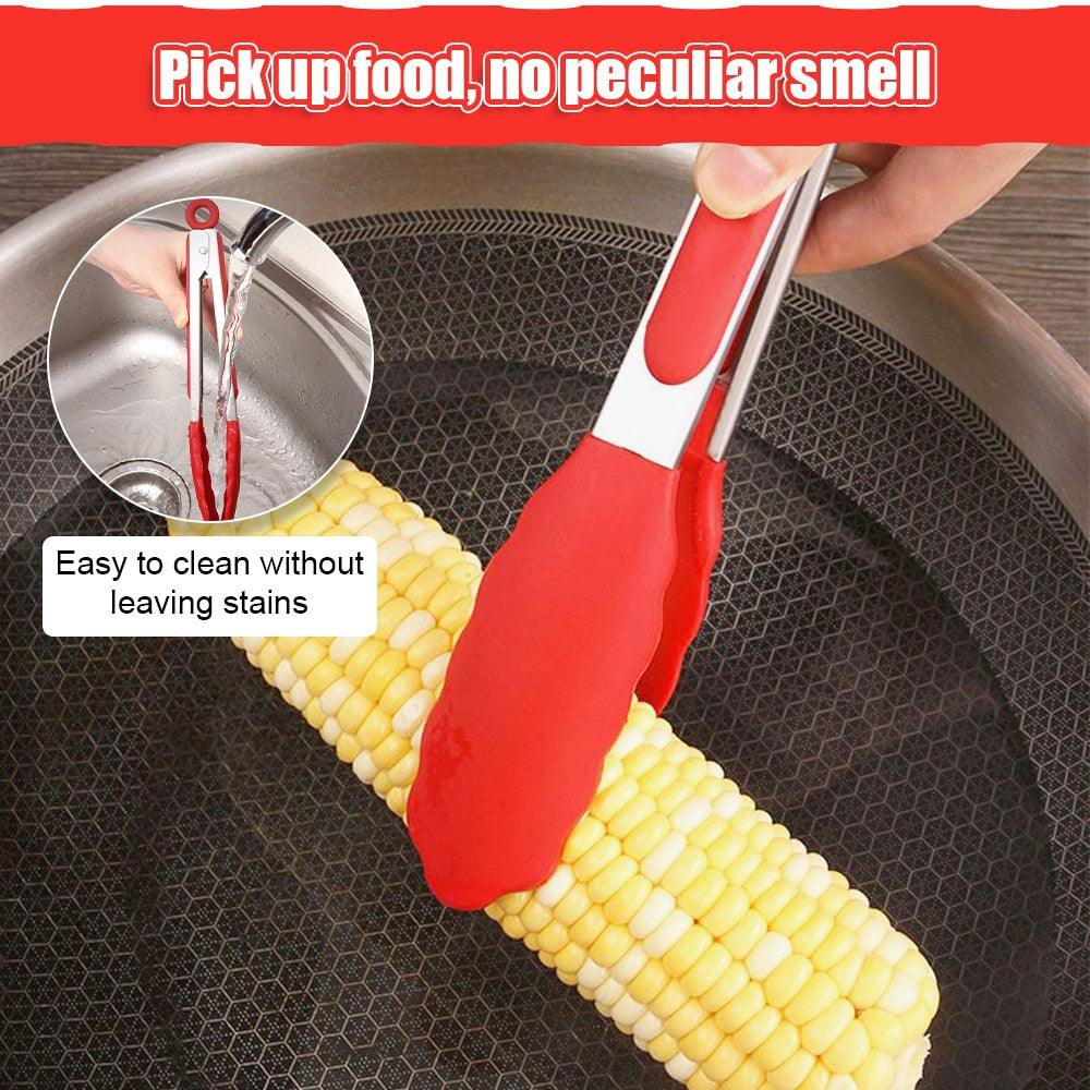 Non-stick silicone BBQ tongs gripping food on barbecue grill